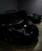 A black Lamborghini in low light