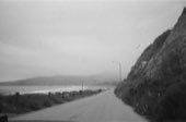 A coastline under grey light, on film