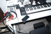 A keyboard and gear set up in a cabin