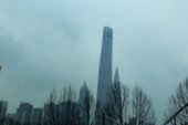 A tower disappearing into fog