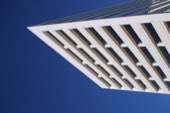 A pale concrete building against the sky