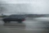 A slope disappearing into falling snow