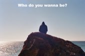 A figure sitting alone on a headland above the ocean